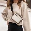 A woman wearing a beige belt bag