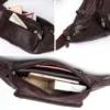 A brown leather bag with a cell phone in it