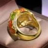 Gold-tone enamel flower ring with colorful detailing