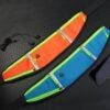Two different colored sports belts laying on the ground